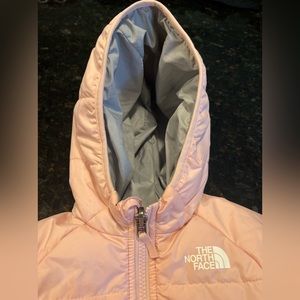 The North Face 12-18M reversible pink/gray puffy jacket
